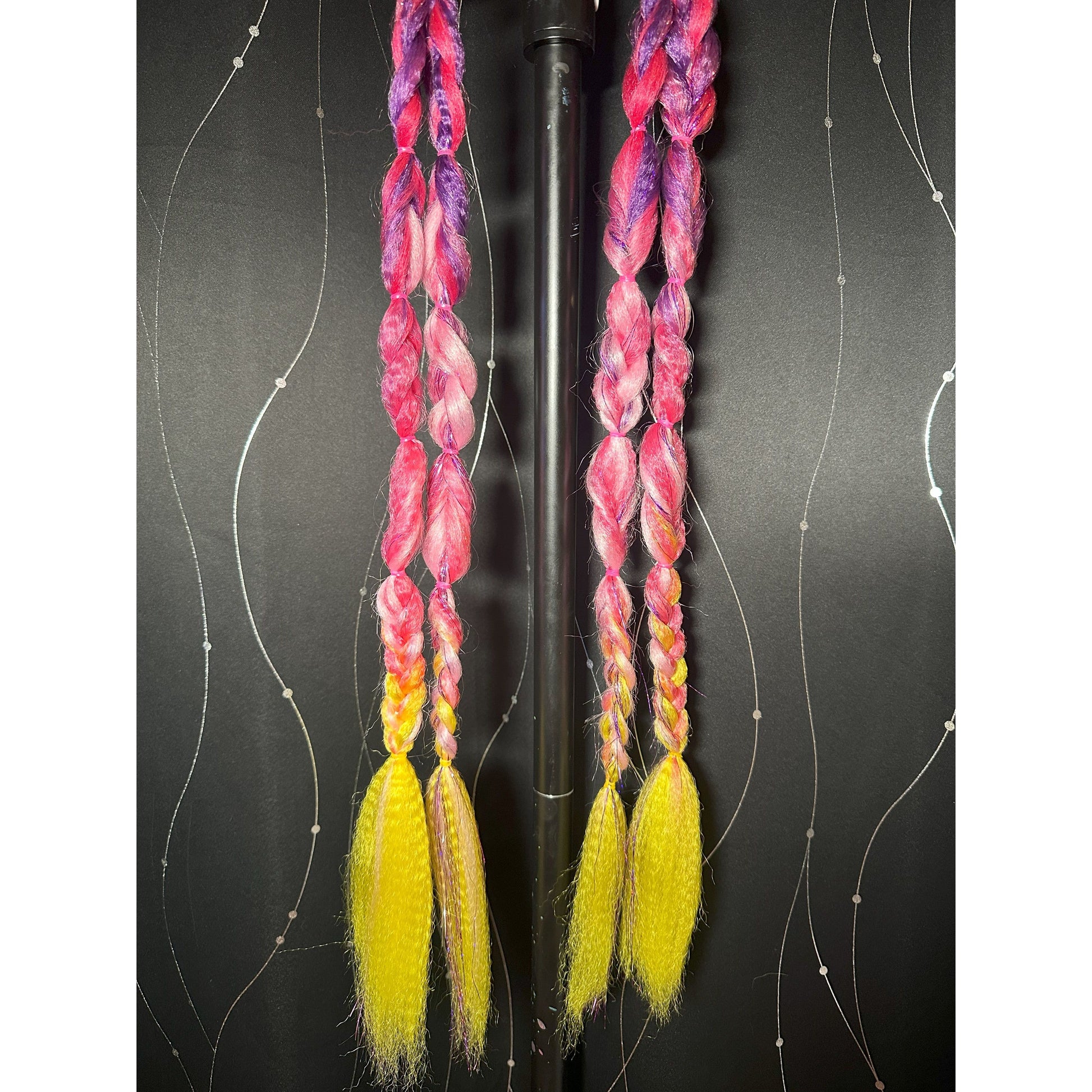 This handmade set by Jessica is 23 inches long, 2 pieces per pony, 2 ponytails - Purple, Hot Pink, Light Pink and Neon Yellow ombre with loops, braids and crimped ends.